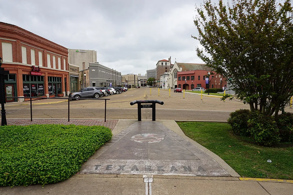 State Line Avenue, downtown Texarkana, with the city name set into the sidewalk